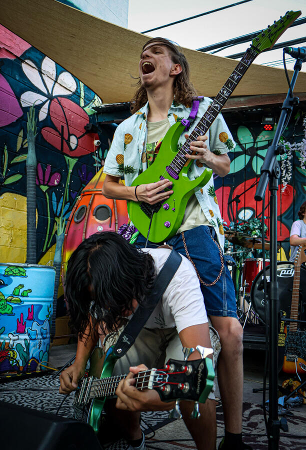 Noah Riding Charles While Playing the Guitar